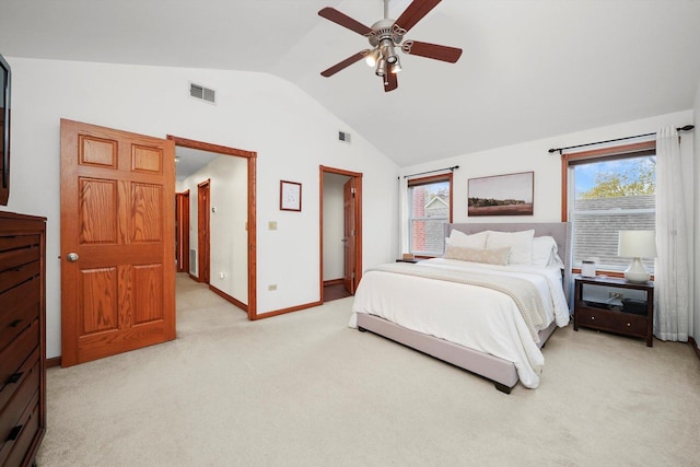 carpeted bedroom featuring vaulted ceiling and ceiling fan