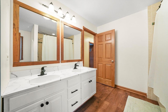 bathroom with vanity and hardwood / wood-style floors