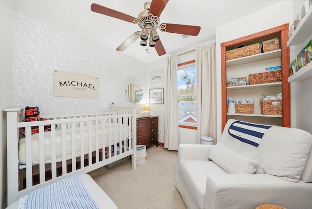 bedroom featuring light carpet and ceiling fan