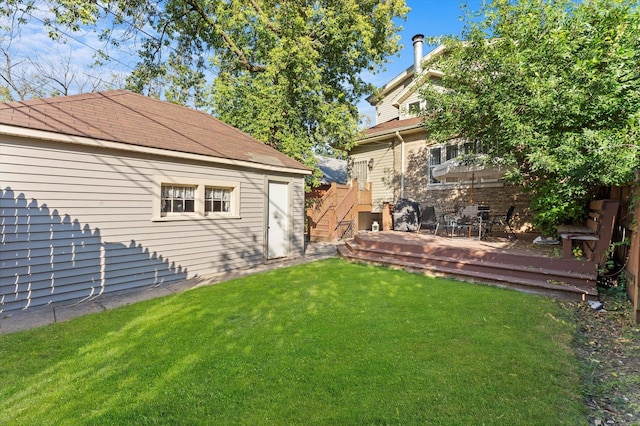 view of yard with a wooden deck