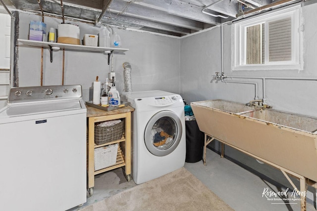 laundry area featuring washer and dryer and sink