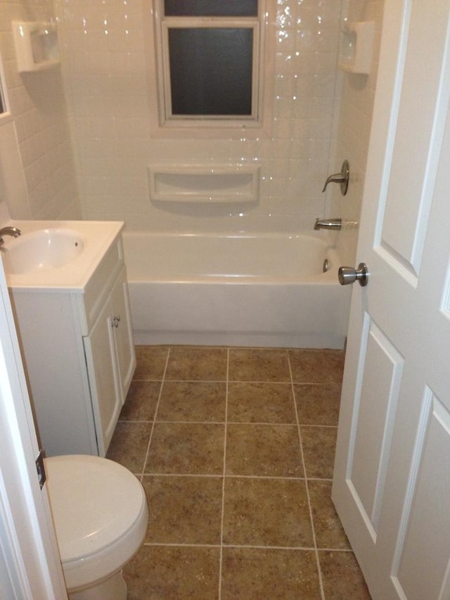 full bathroom featuring tile patterned floors, vanity, toilet, and tub / shower combination