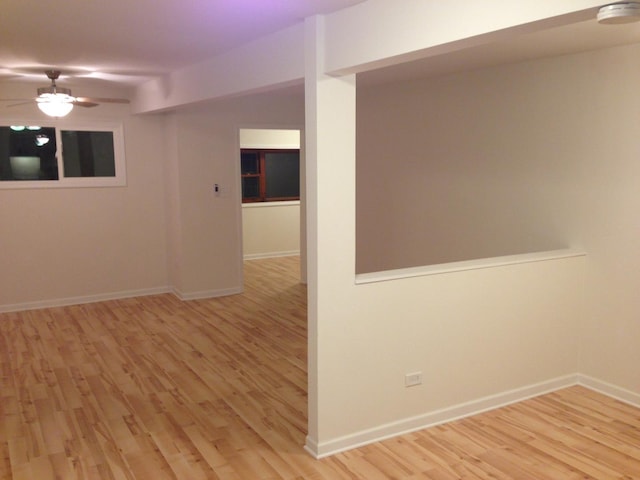 unfurnished room featuring ceiling fan and light wood-type flooring