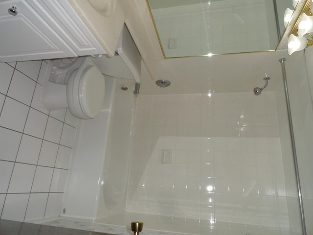 bathroom featuring tile patterned floors and a shower