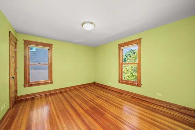 spare room featuring hardwood / wood-style flooring