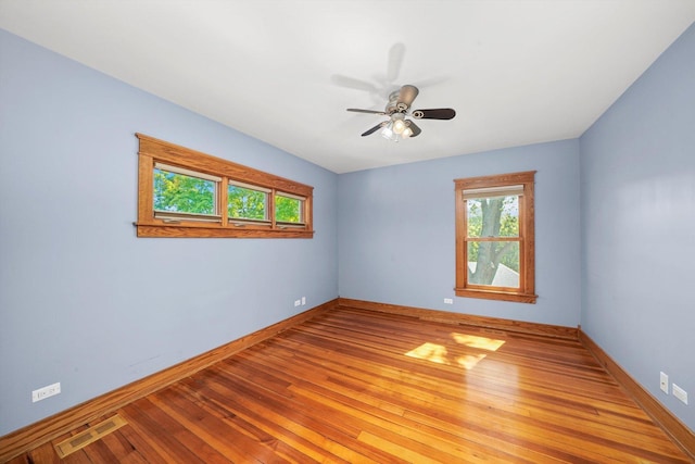 unfurnished room with ceiling fan and light hardwood / wood-style flooring