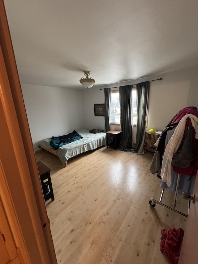 bedroom with light hardwood / wood-style floors