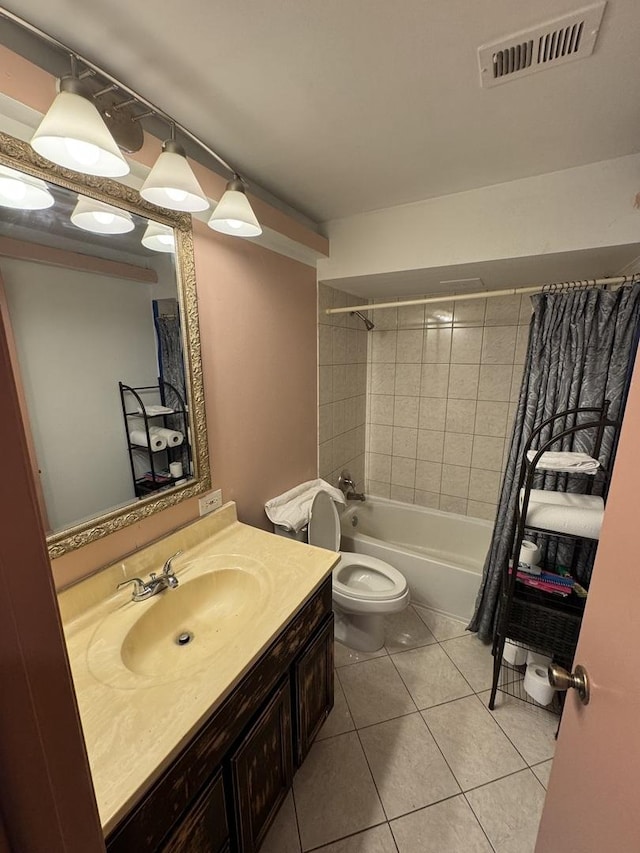 full bathroom with tile patterned floors, shower / bath combo with shower curtain, vanity, and toilet