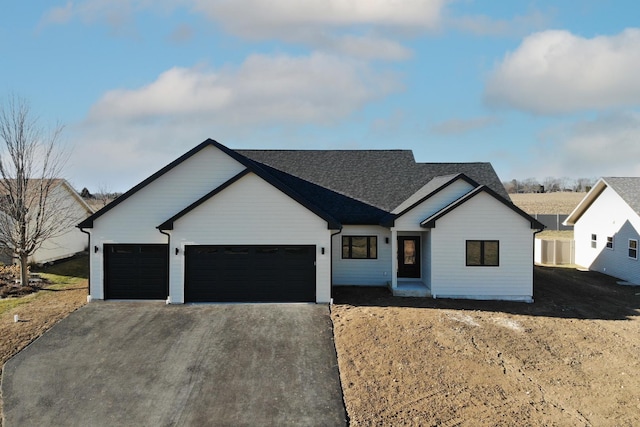 modern farmhouse featuring a garage