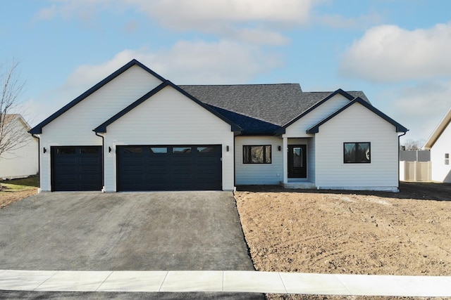 modern farmhouse style home with a garage