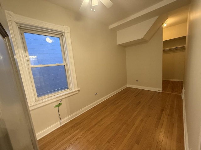 additional living space featuring ceiling fan, baseboards, and hardwood / wood-style floors