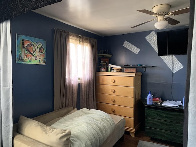 bedroom with hardwood / wood-style flooring and ceiling fan