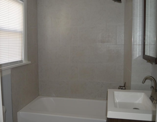 bathroom featuring a wealth of natural light and sink