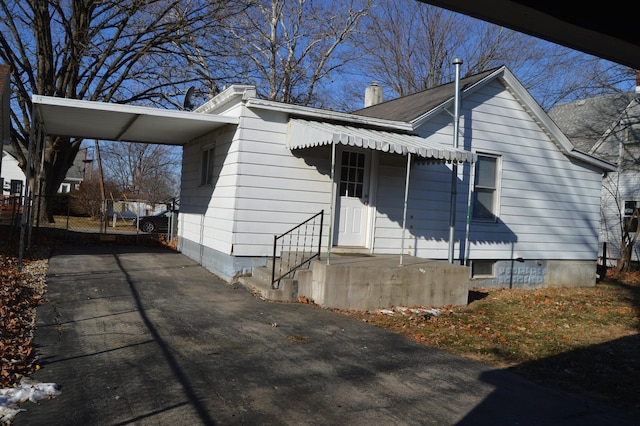 view of front of property with a carport