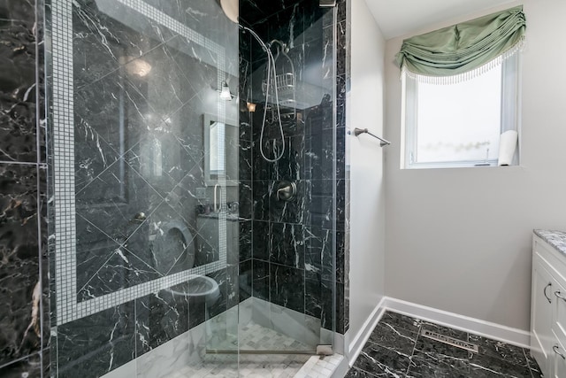 bathroom with vanity and a shower with door