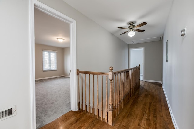 corridor with dark hardwood / wood-style floors