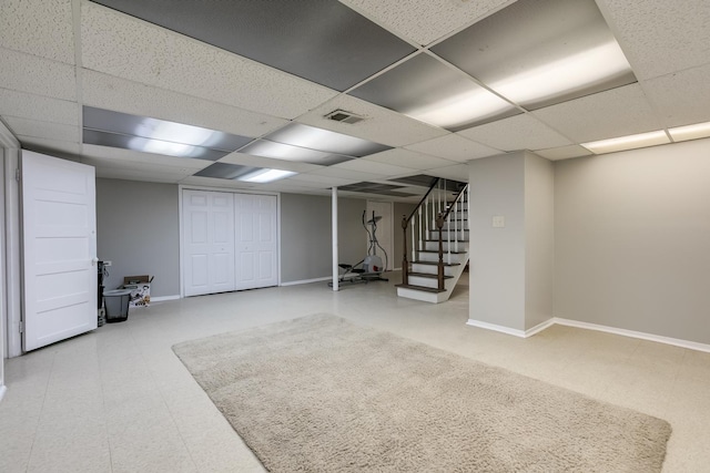 basement featuring a drop ceiling