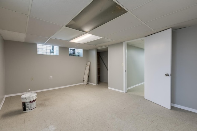 basement featuring a drop ceiling