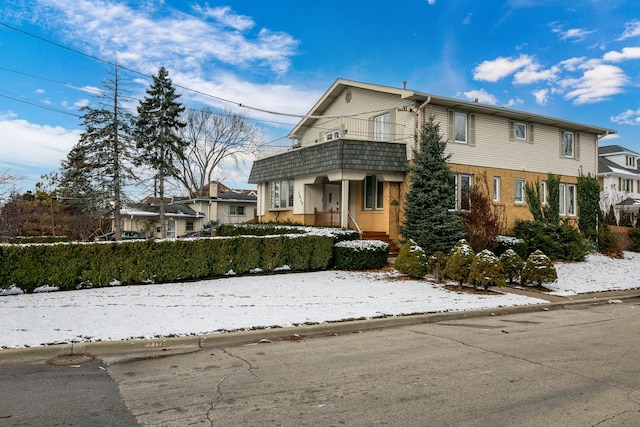 front of property with a balcony