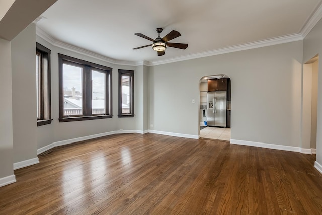 interior space featuring ceiling fan, crown molding, and light hardwood / wood-style flooring