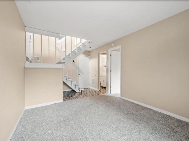 unfurnished living room featuring carpet flooring