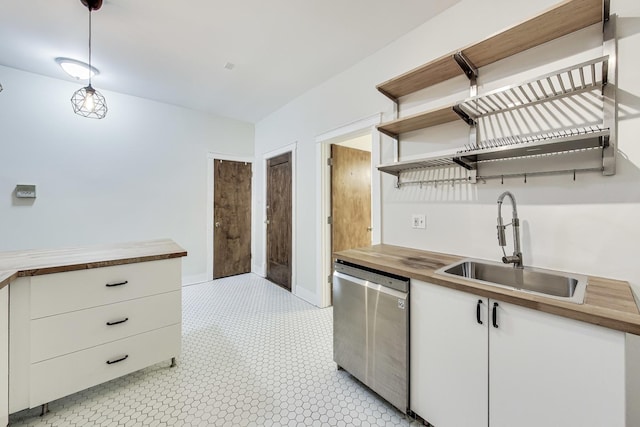 kitchen with white cabinets, butcher block countertops, and dishwasher