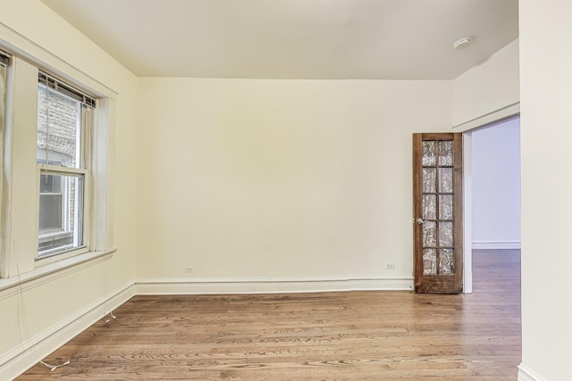 empty room featuring light hardwood / wood-style flooring and plenty of natural light