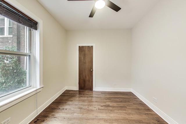 empty room featuring hardwood / wood-style floors and ceiling fan