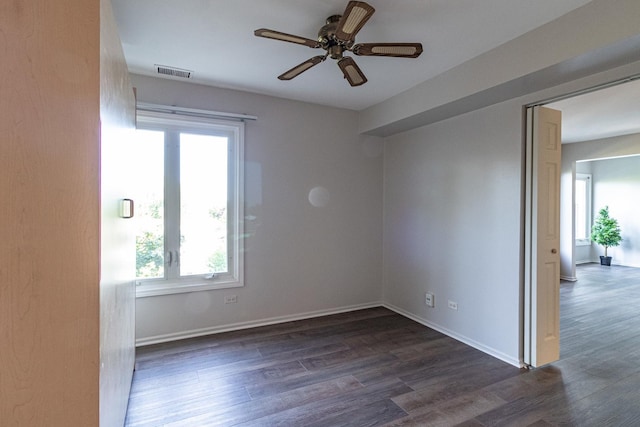 unfurnished room featuring dark hardwood / wood-style flooring and ceiling fan