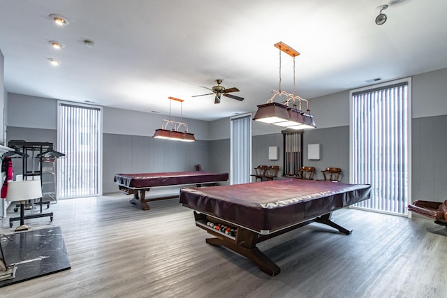 recreation room featuring wood-type flooring, ceiling fan, and billiards