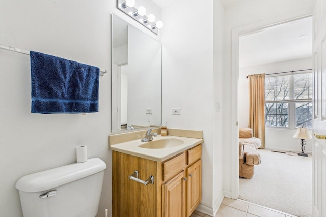 bathroom with tile patterned floors, vanity, and toilet