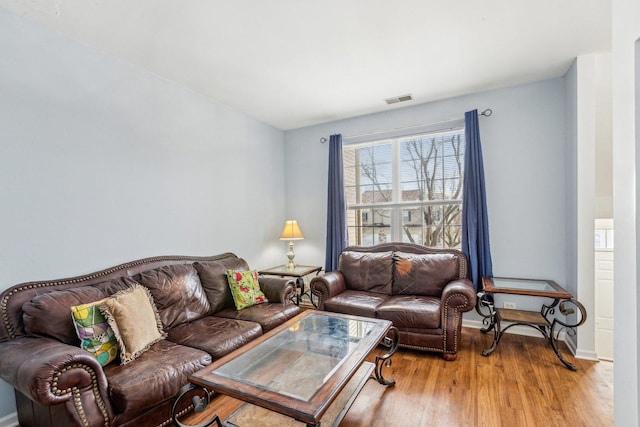 living room with light hardwood / wood-style floors