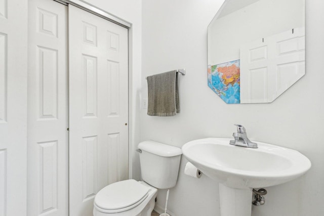 bathroom with toilet and sink