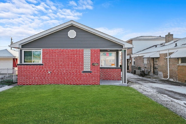 view of property exterior with a yard