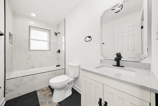 full bathroom featuring vanity, toilet, and tiled shower / bath