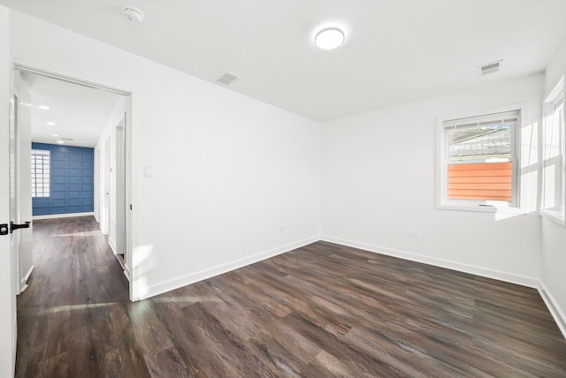 empty room featuring dark hardwood / wood-style floors