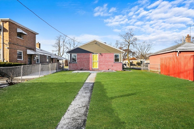 rear view of property with a lawn