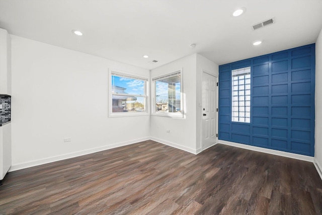 entrance foyer with dark hardwood / wood-style floors