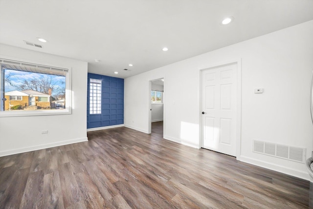 empty room with dark hardwood / wood-style floors