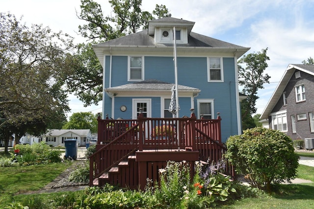 back of house featuring central AC