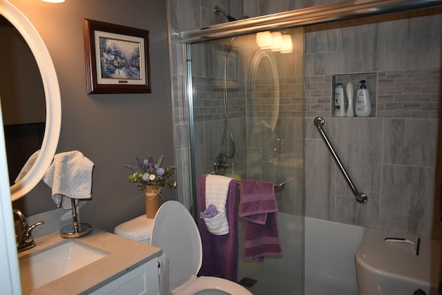 bathroom with vanity, an enclosed shower, and toilet