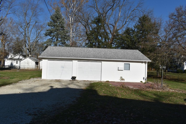 garage featuring a yard