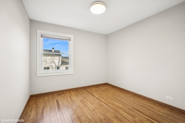 unfurnished room featuring light hardwood / wood-style flooring