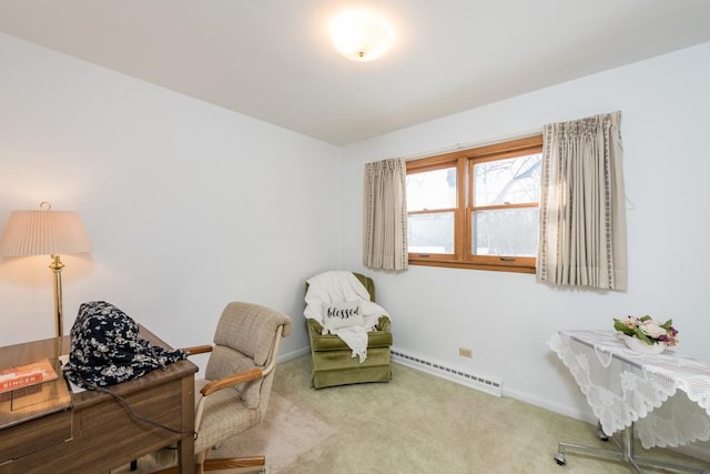 office space featuring a baseboard heating unit and carpet