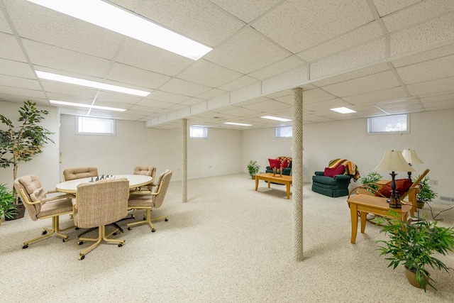 game room featuring a drop ceiling, a healthy amount of sunlight, and carpet