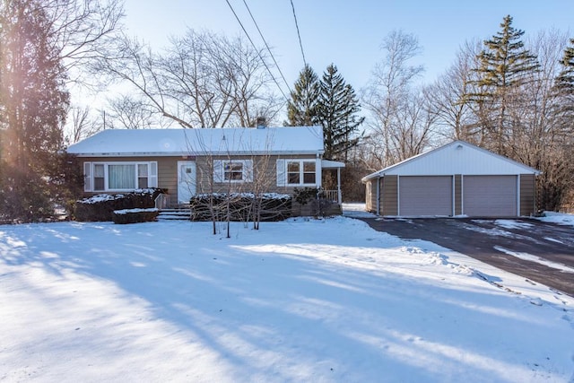 single story home with a garage and an outbuilding