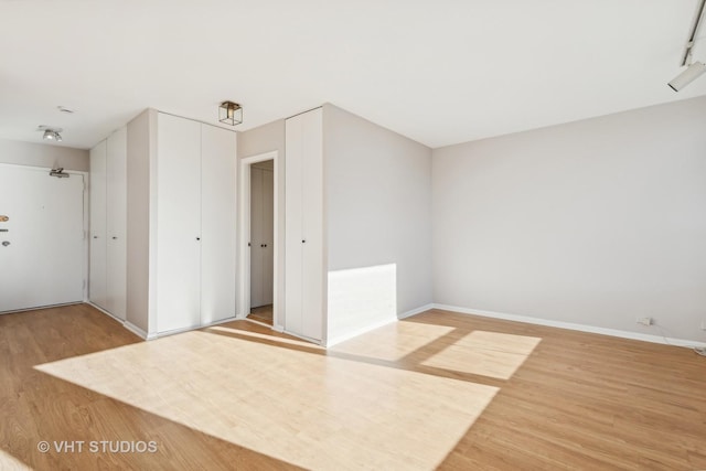 spare room featuring hardwood / wood-style floors