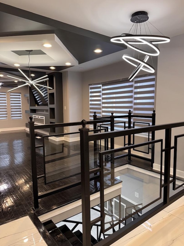 dining area featuring a raised ceiling and a notable chandelier