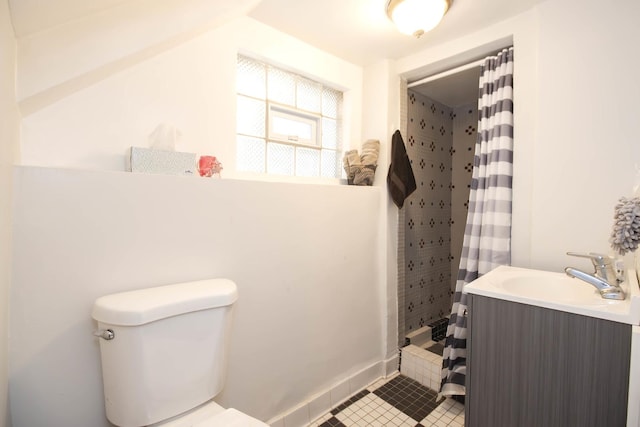 bathroom with vanity, toilet, tile patterned floors, and a shower with shower curtain