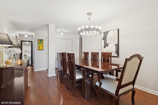 dining space with a chandelier and dark wood-type flooring